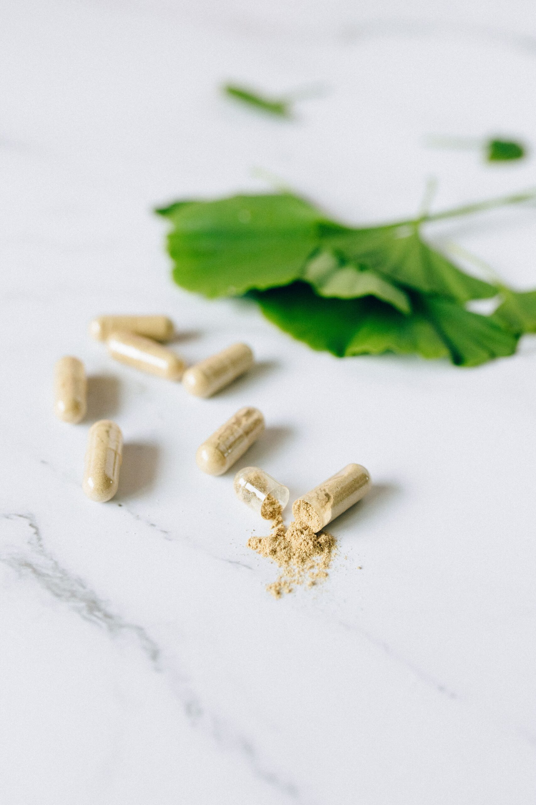 herbal supplement capsules with natural background