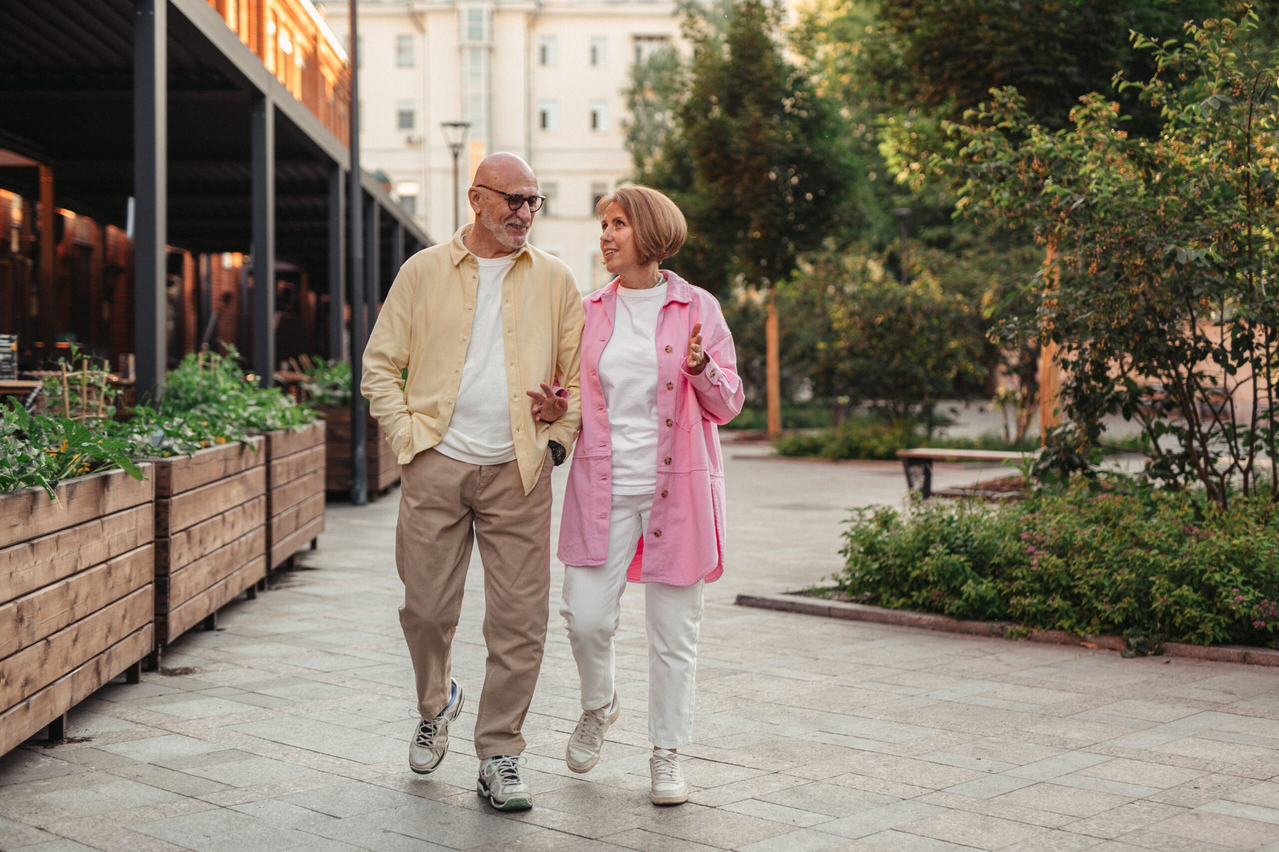 senior couple walking outdoors to improve energy and blood sugar