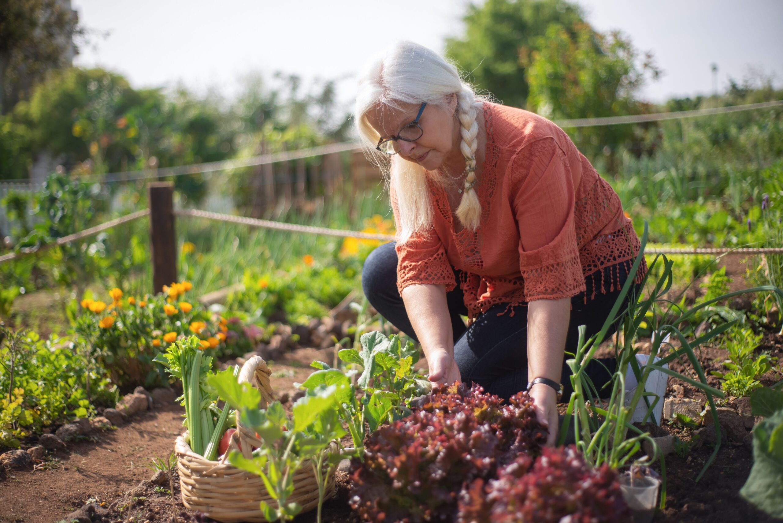 older woman with vegetables — signs of blood sugar imbalance in adults over 55