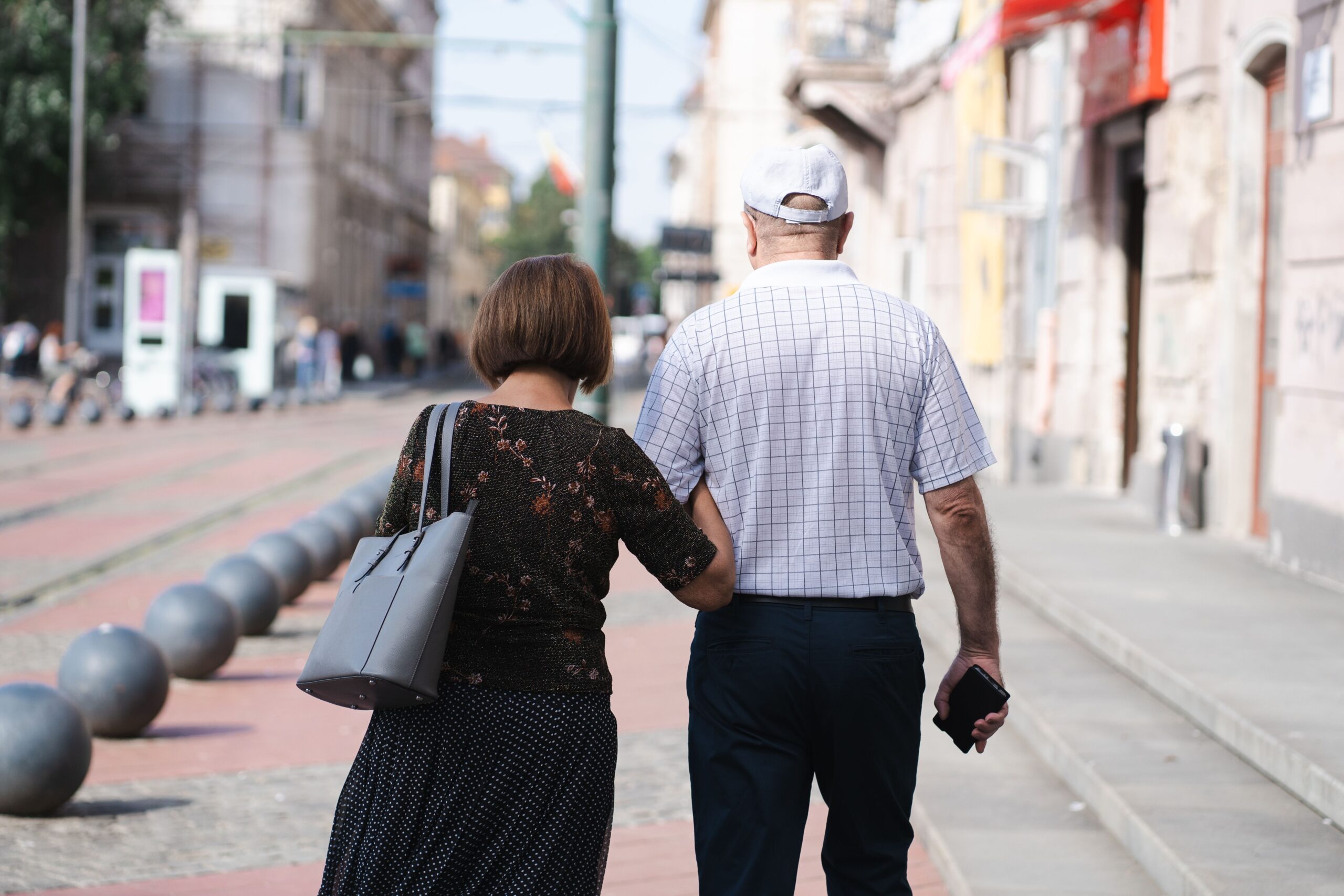 older couple walking — an active lifestyle is key to natural blood sugar support over 55