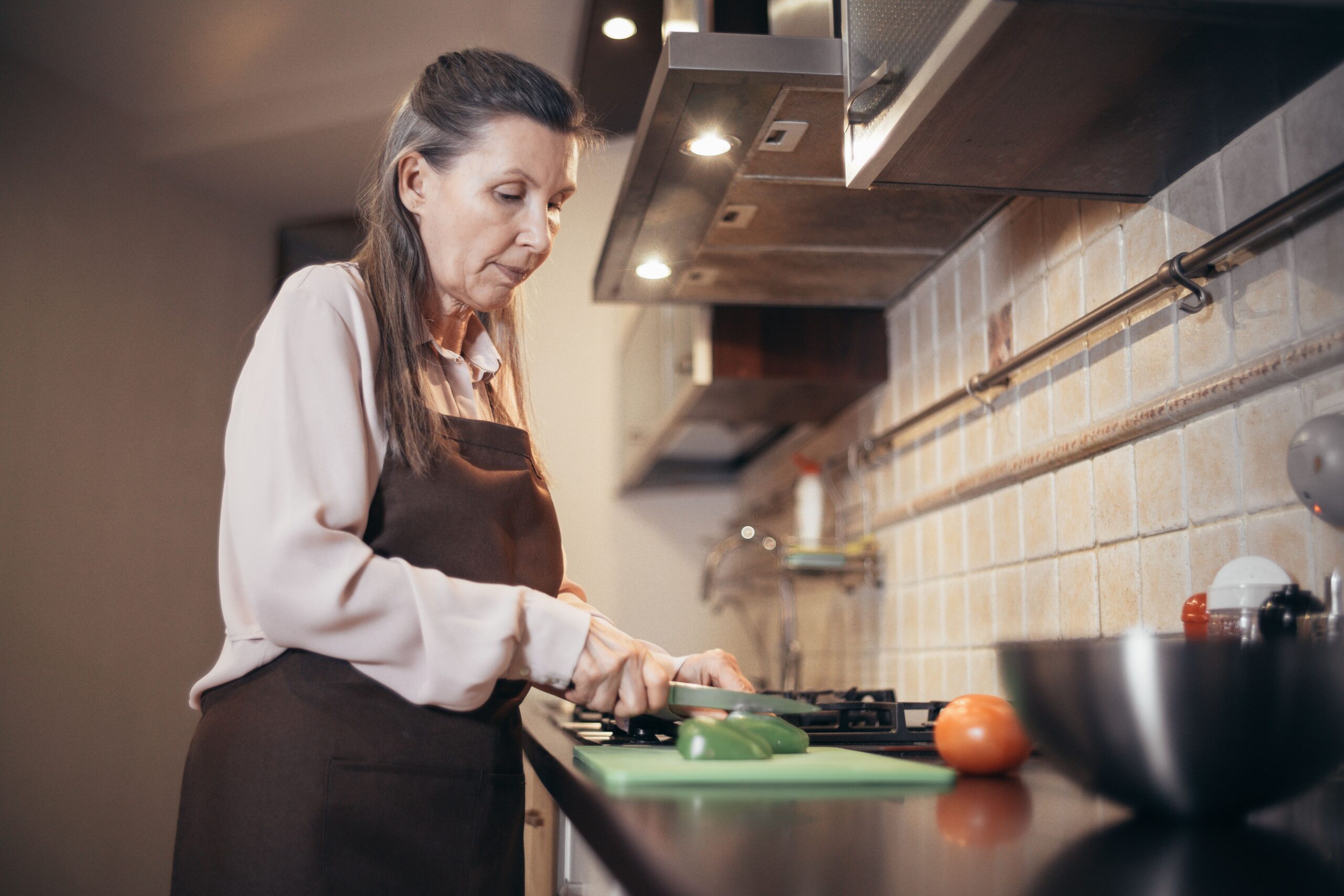 Insulin Resistance Diet: What to Eat and Avoid After 55 Older adult cooking healthy food — insulin resistance diet for adults over 55