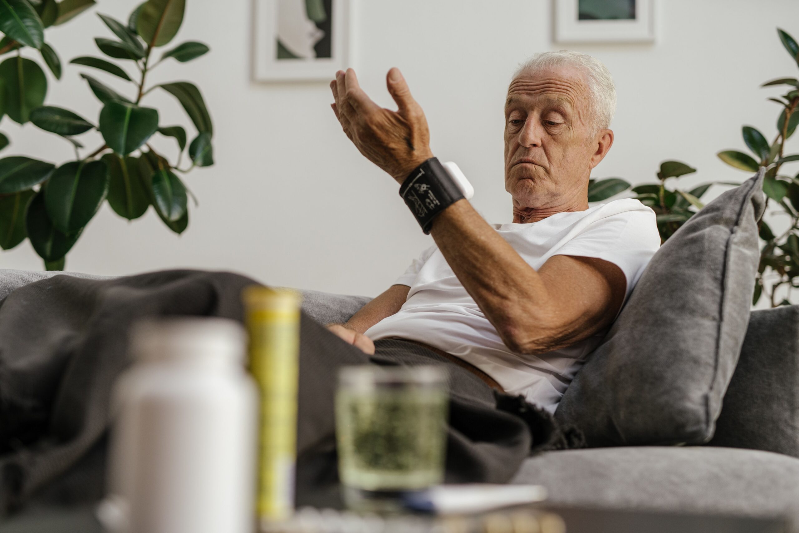 senior man checking blood sugar monitor — tracking progress supports natural blood sugar support over 55